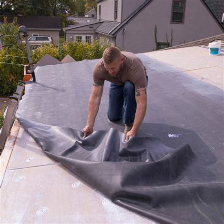 Are rv rubber roofs glued down?